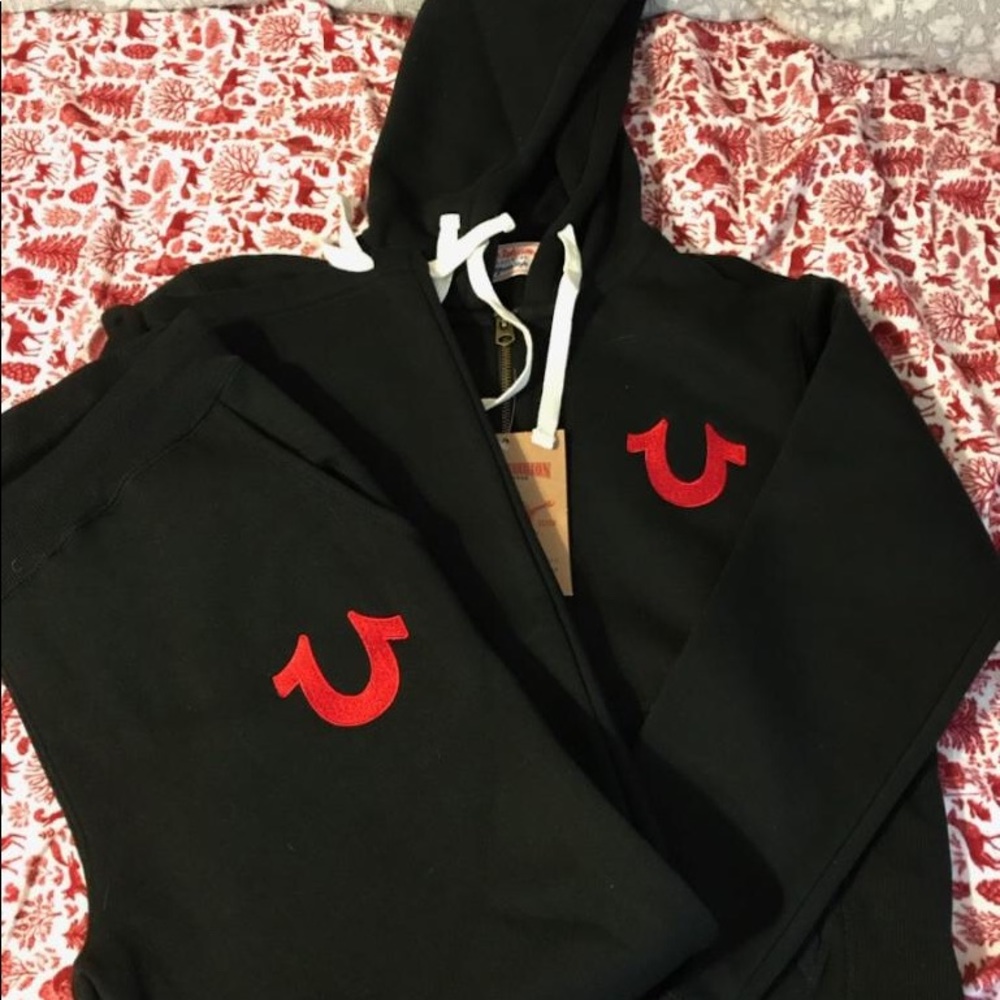 Black suit with red logo